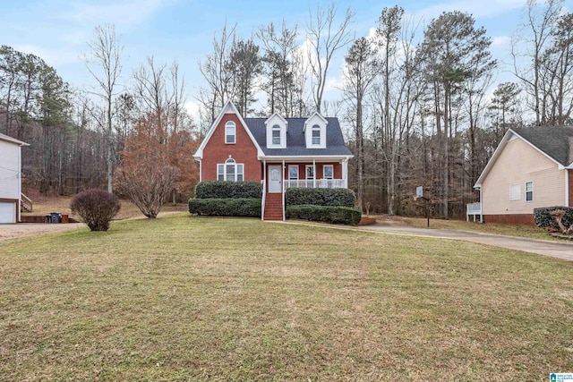 cape cod-style house with a front lawn