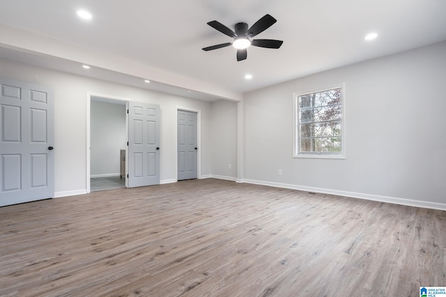 unfurnished bedroom featuring ceiling fan and light wood-type flooring