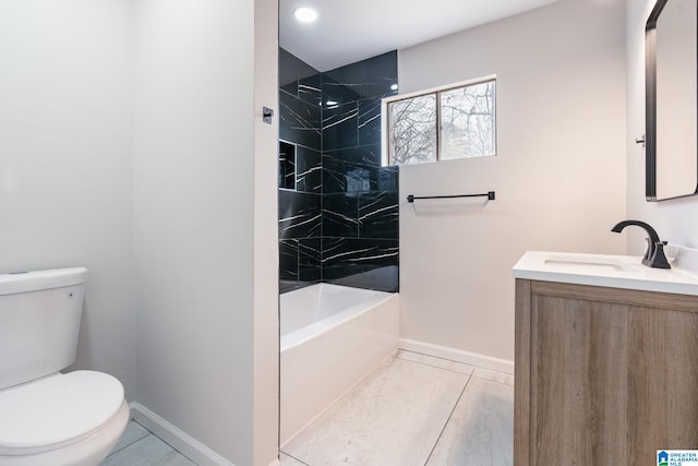 full bathroom featuring tiled shower / bath combo, vanity, tile patterned flooring, and toilet