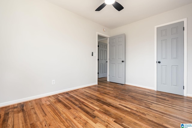 unfurnished bedroom featuring ceiling fan and wood-type flooring