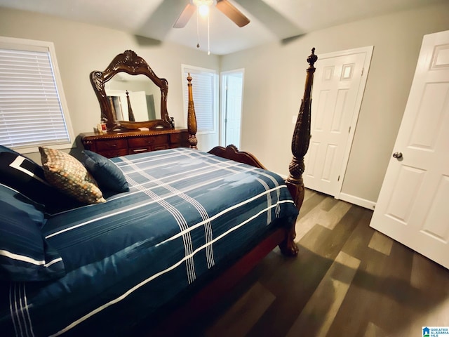 bedroom with dark wood-type flooring and ceiling fan