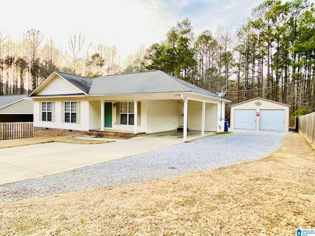 single story home featuring an outbuilding and a garage