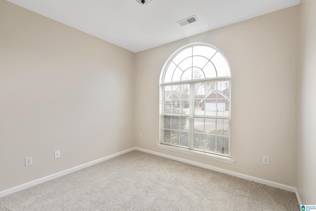 view of carpeted spare room