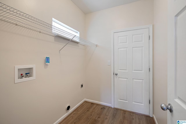 washroom featuring hardwood / wood-style flooring, washer hookup, and hookup for an electric dryer