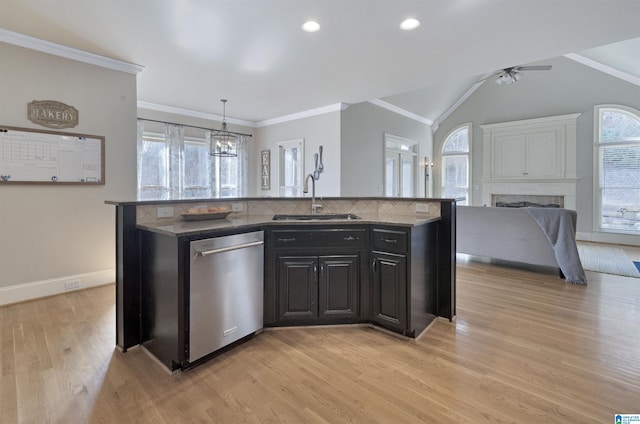 kitchen with sink, light hardwood / wood-style flooring, dishwasher, hanging light fixtures, and a center island with sink