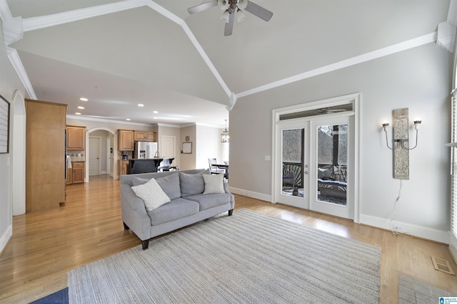 living room with crown molding, high vaulted ceiling, ceiling fan, and light hardwood / wood-style floors