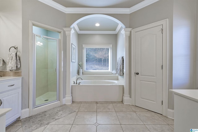 bathroom with crown molding, tile patterned floors, independent shower and bath, and ornate columns