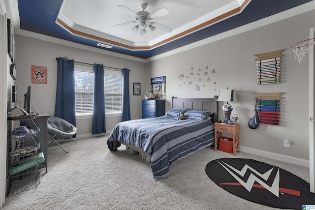 carpeted bedroom with crown molding, a raised ceiling, and ceiling fan