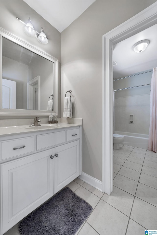 full bathroom with vanity, toilet, tile patterned floors, and  shower combination