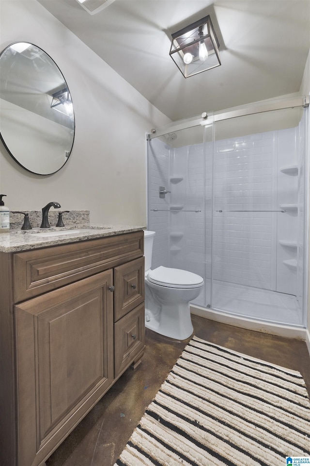 bathroom with vanity, toilet, and walk in shower