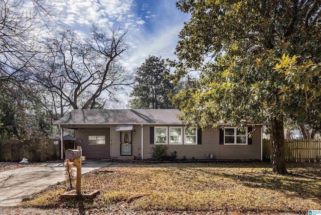 ranch-style home with a carport