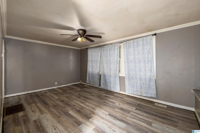 unfurnished room with hardwood / wood-style floors, crown molding, and ceiling fan