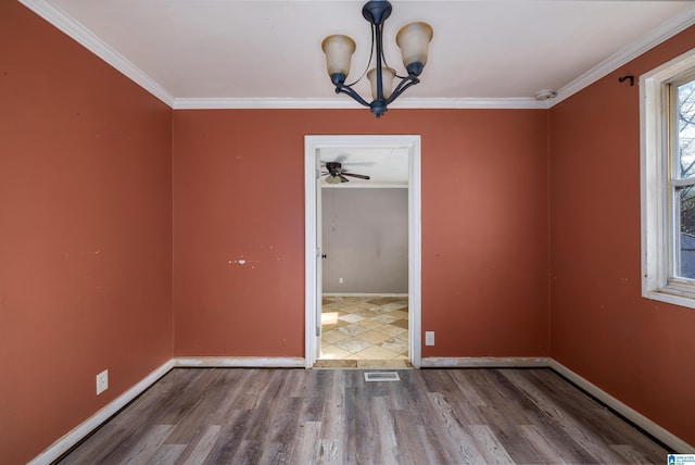 unfurnished dining area with an inviting chandelier, ornamental molding, and wood-type flooring