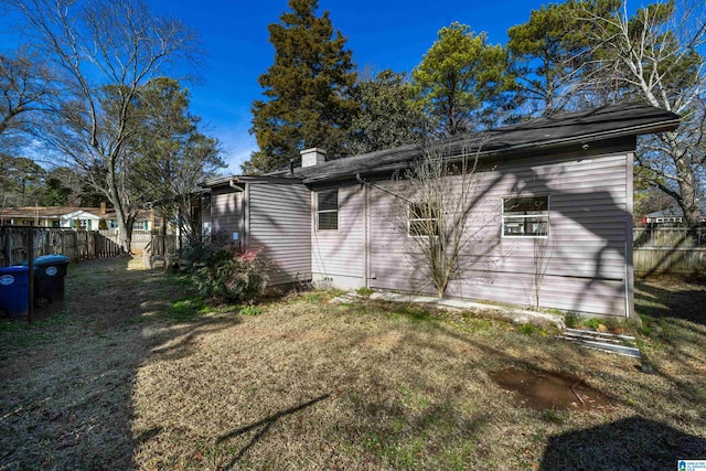 view of home's exterior featuring a lawn