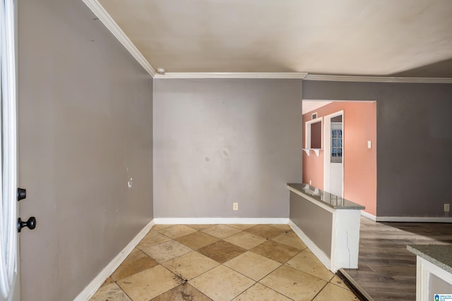 spare room with crown molding