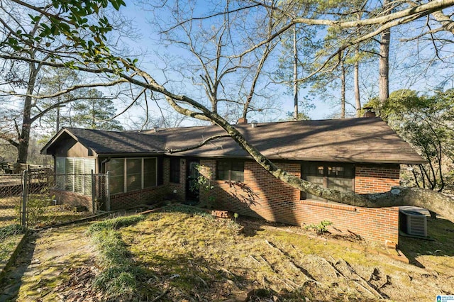 ranch-style house with central air condition unit