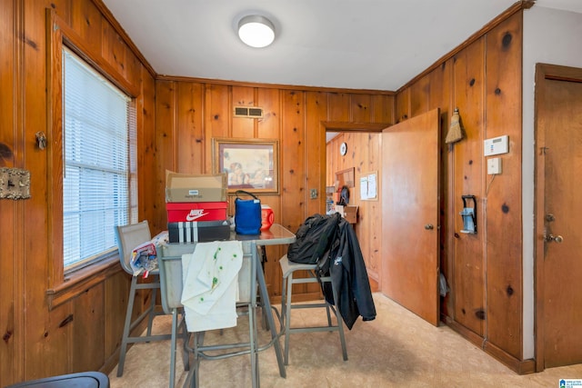 dining area with wood walls