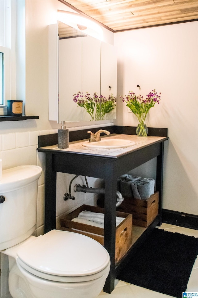 bathroom with vanity, wood ceiling, and toilet