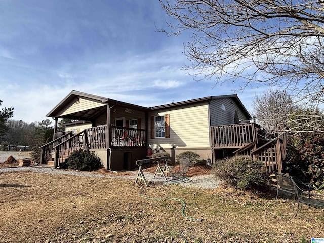 view of side of home with a deck