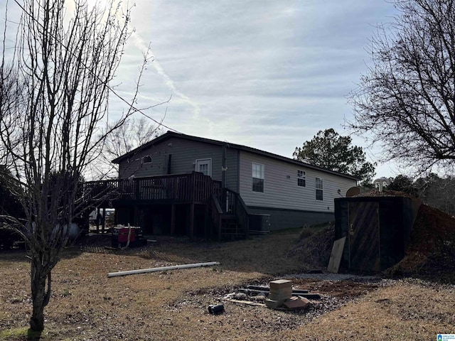 rear view of house featuring a deck