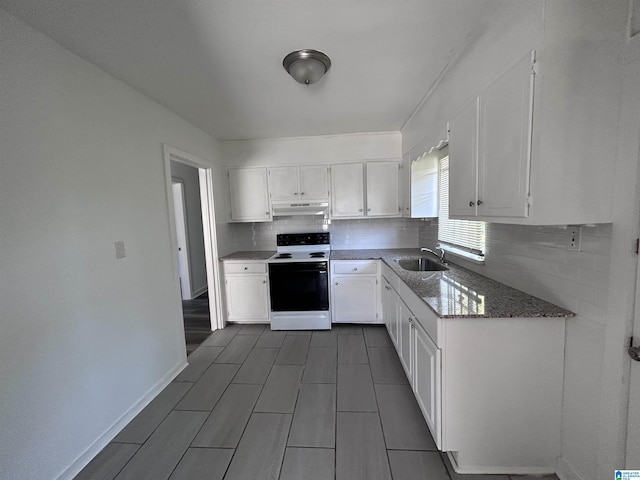 kitchen with white range with electric stovetop, white cabinetry, sink, backsplash, and dark stone counters