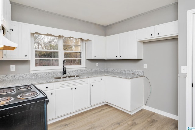 kitchen featuring sink, white cabinets, black range with electric stovetop, light stone countertops, and light hardwood / wood-style flooring