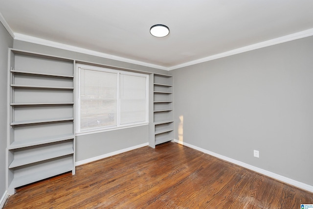 unfurnished bedroom with ornamental molding and dark hardwood / wood-style floors