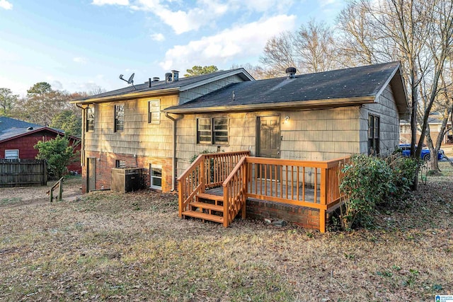 back of property featuring a wooden deck