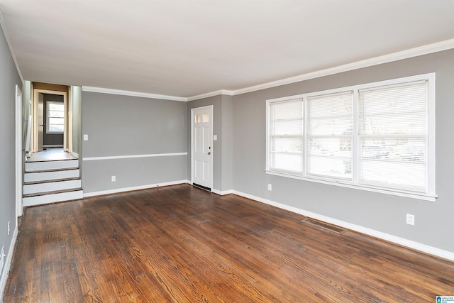 unfurnished living room featuring ornamental molding and dark hardwood / wood-style floors