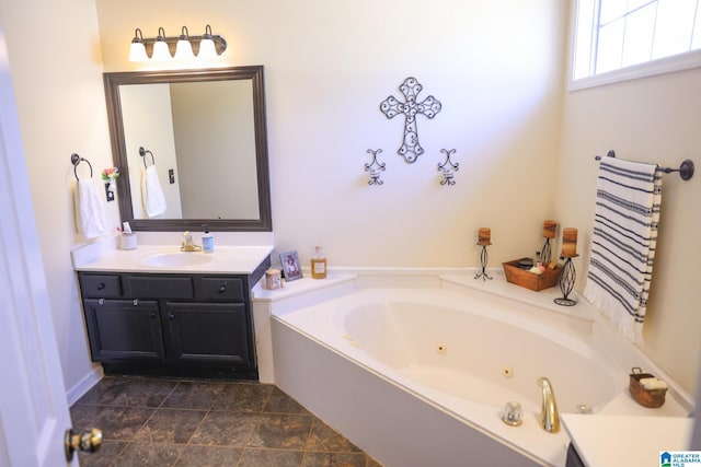 bathroom featuring a tub to relax in and vanity