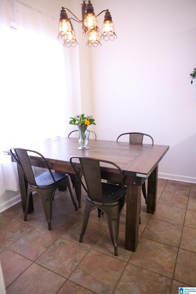 dining area featuring an inviting chandelier