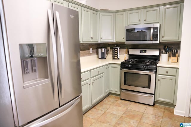 kitchen featuring stainless steel appliances and light tile patterned floors