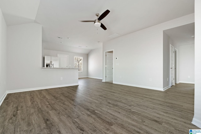 unfurnished living room featuring ceiling fan and dark hardwood / wood-style flooring