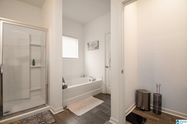 bathroom with separate shower and tub