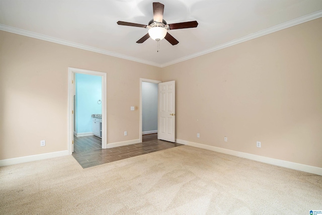 unfurnished bedroom featuring connected bathroom, crown molding, ceiling fan, and carpet