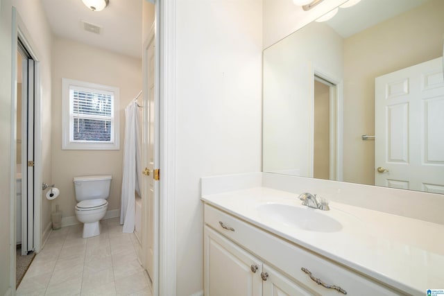 bathroom with vanity, tile patterned flooring, a shower with curtain, and toilet