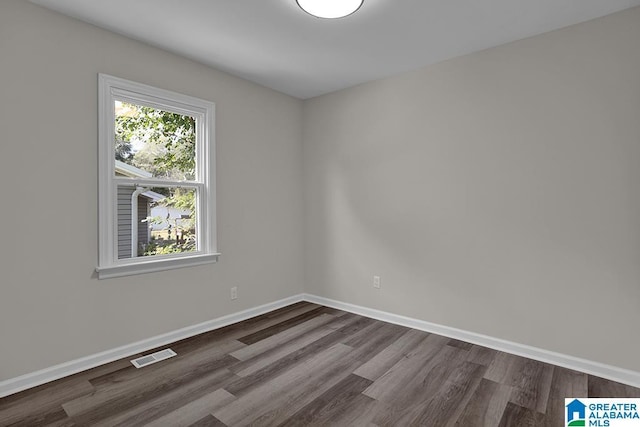 unfurnished room with hardwood / wood-style floors