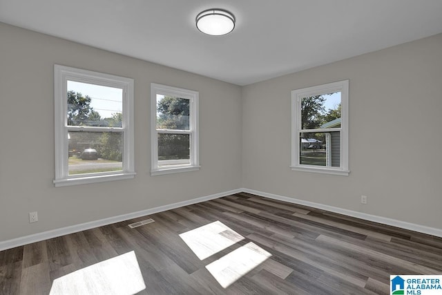 empty room featuring dark hardwood / wood-style floors