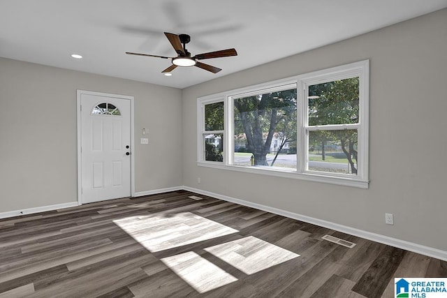 entryway with dark hardwood / wood-style floors and ceiling fan