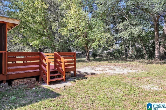 view of yard featuring a wooden deck