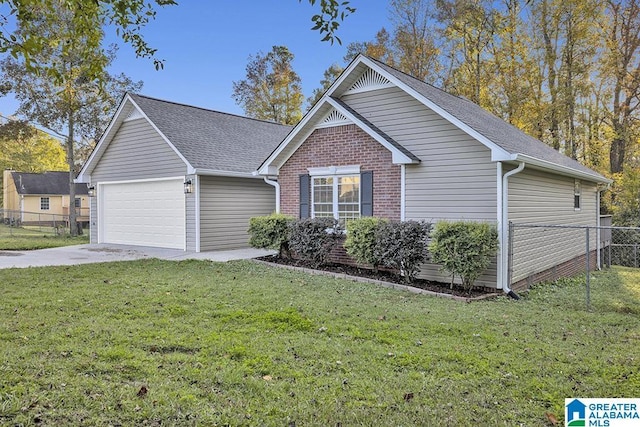 view of front facade with a garage and a front yard