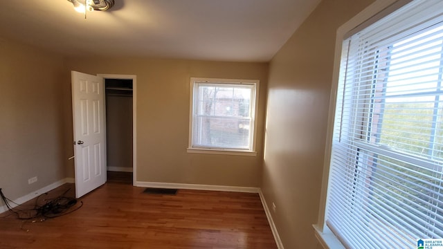 unfurnished bedroom featuring hardwood / wood-style floors