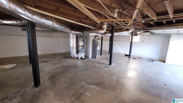 basement with heating unit and water heater