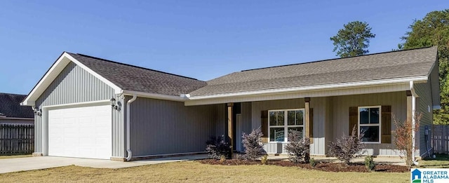 single story home with a garage, covered porch, and a front lawn