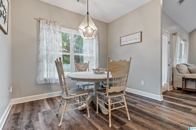 dining space featuring dark hardwood / wood-style flooring