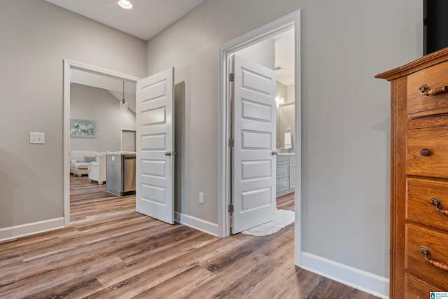 corridor featuring hardwood / wood-style floors