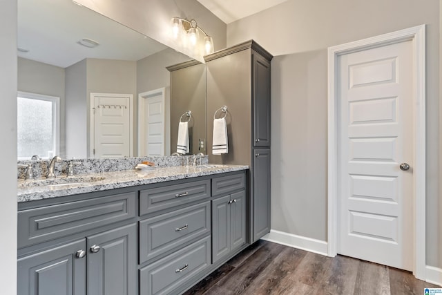 bathroom featuring vanity and hardwood / wood-style floors