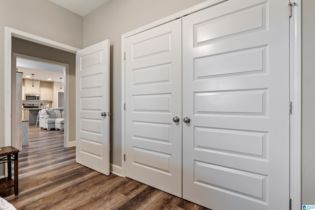 corridor with dark wood-type flooring