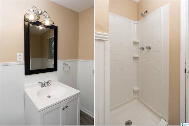 bathroom featuring walk in shower and vanity