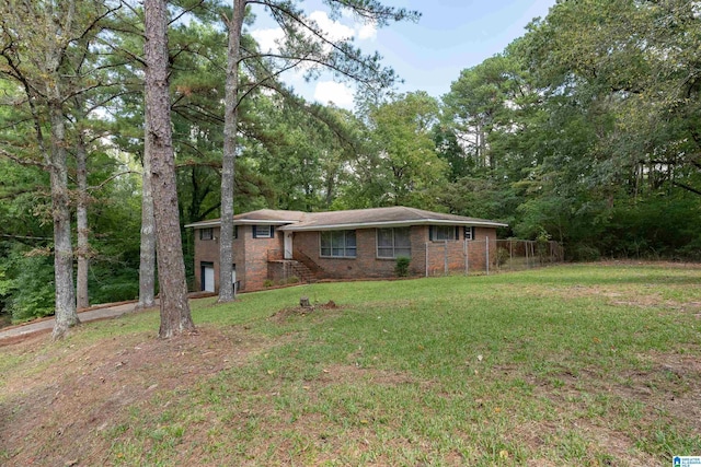 view of front of house with a garage and a front yard